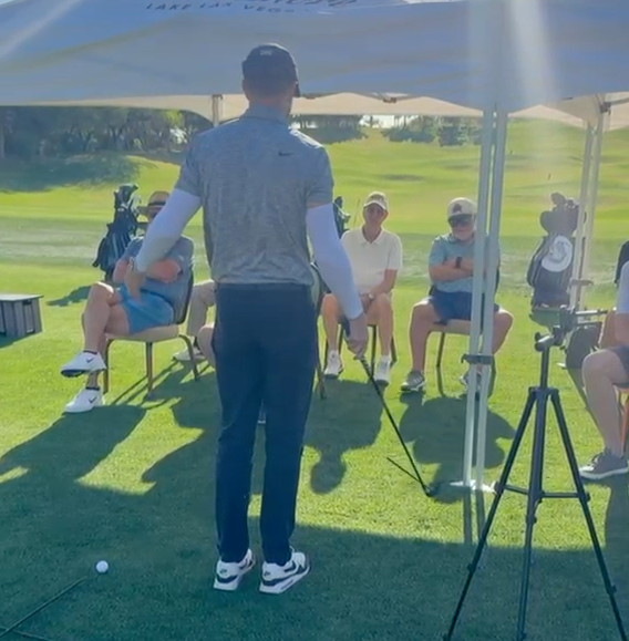 Coach teaching students during an outdoor range session