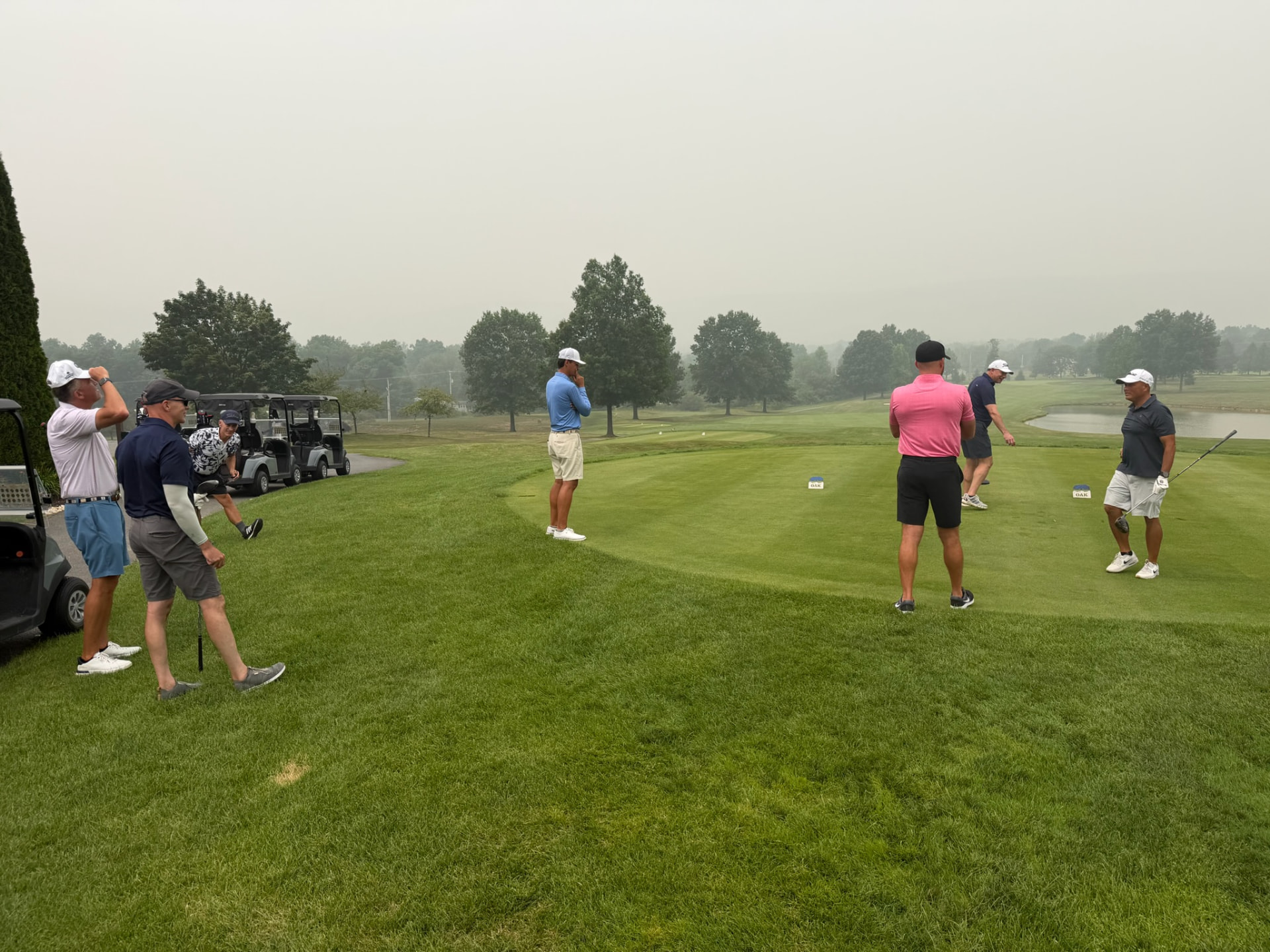 Golf school students gathered on the tee